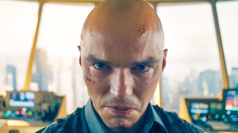Nicholas Hoult as Lex Luthor in Superman, looking intensely past the camera in his tower.