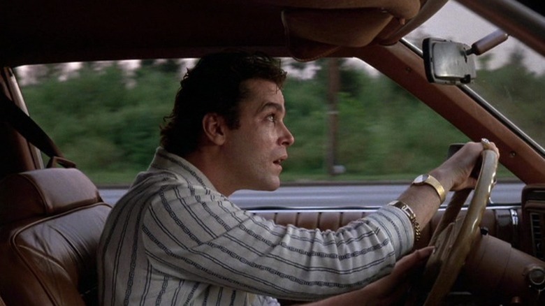 Ray Liotta as Henry Hill driving car and looking up at sky while sweating in Goodfellas
