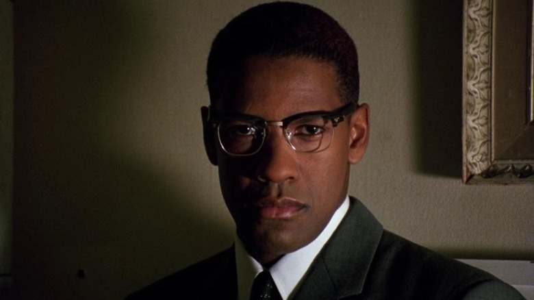 Denzel Washington as Malcolm X looking square at the camera in Malcolm X