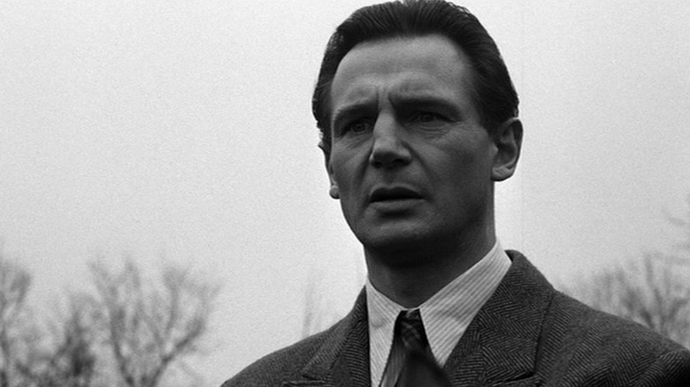 Liam Neeson as Oskar Schindler with concerned expression in Schindler's List