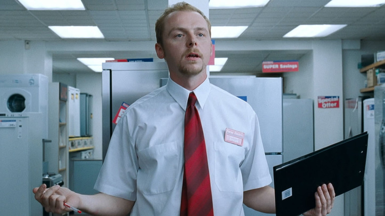 Simon Pegg as Shaun in Shaun of the Dead, looking exasperated at his retail sales job.