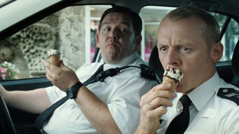 Danny Butterman (Nick Frost) watches Nicholas Angel (Simon Pegg) intently eat an ice cream cone in Hot Fuzz
