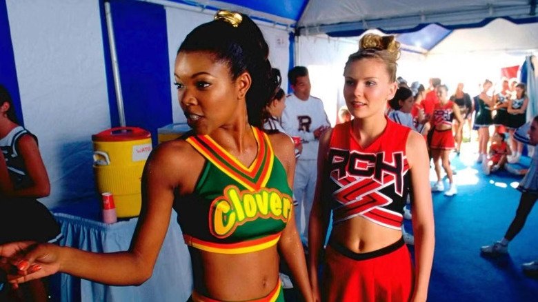 Gabrielle Union as Isis leads the Clovers through a gym in Bring it On