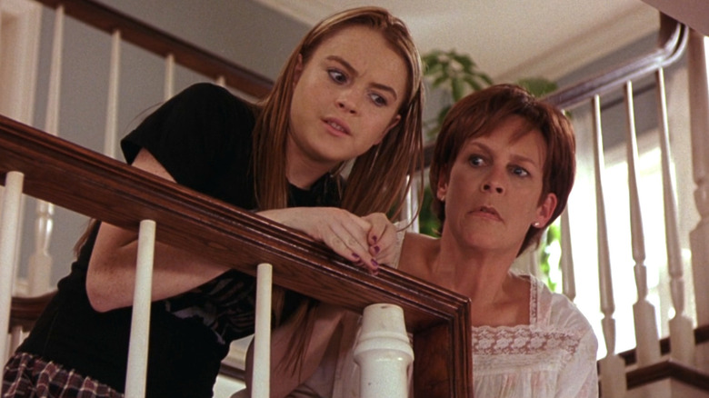 Lindsay Lohan stands on stairs as Anna Coleman while next to Jamie Lee Curtis as Tess Coleman in Freaky Friday