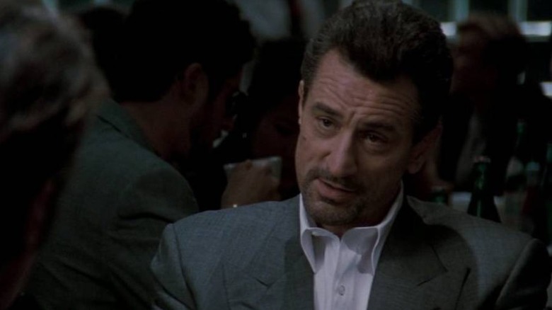 Neil McCauley (Robert de Niro) sitting in a restaurant in Heat