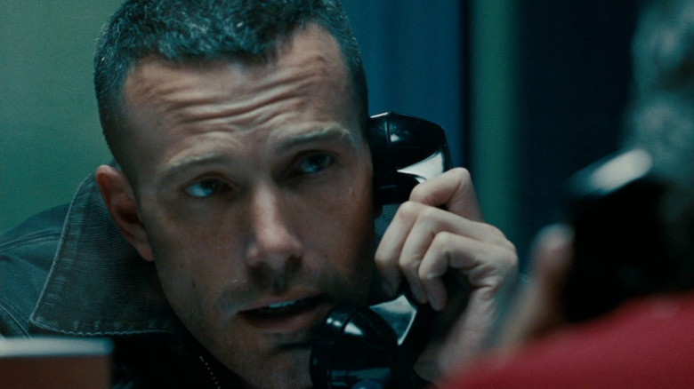 Doug MacRay (Ben Affleck) talking on a prison phone in The Town