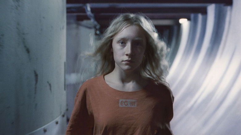 Hanna Heller (Saiorse Ronan) walks through a corridor in Hanna