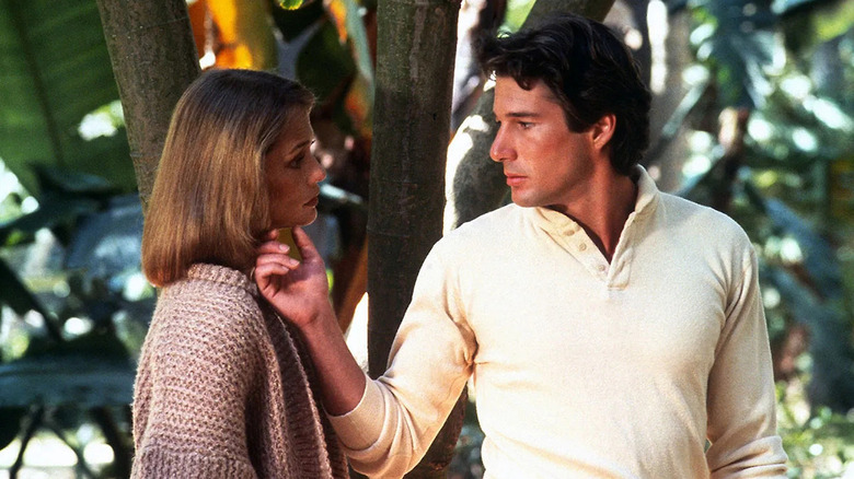 Julian Kay (Richard Gere) caresses the face of Michelle Stratton (Lauren Hutton) by a tree in American Gigolo