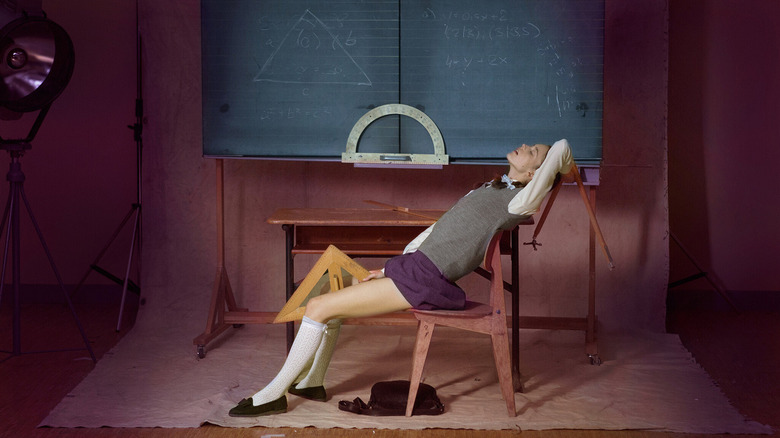 Joe (Stacy Martin) pleasures herself with a triangle on the set of a classroom in Nymphomaniac