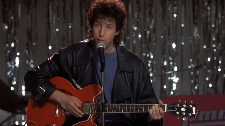 Robbie Hart (Adam Sandler) playing the guitar in The Wedding Singer