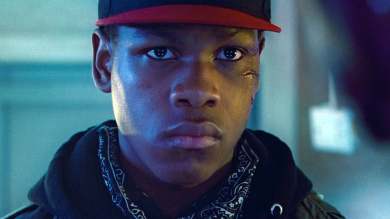 Moses (John Boyega) looks with concern and strength in Attack the Block