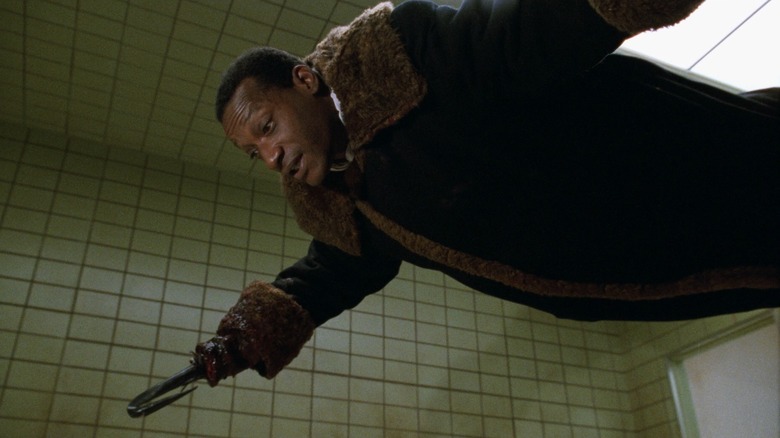Candyman (Tony Todd) floats in a bathroom in Candyman