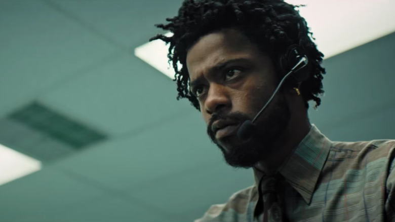 Cash (LaKeith Stanfield) struggles at his telemarketer job in Sorry to Bother You