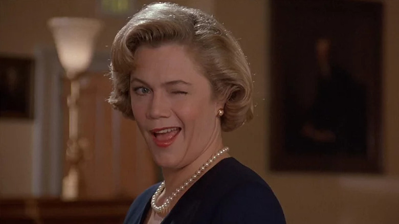 Kathleen Turner winking as Beverly