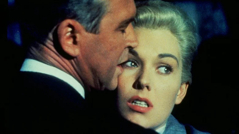 James Stewart as Scottie holding Kim Novak close in Vertigo