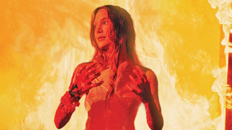 Sissy Spacek as Carrie, surrounded by fire in Carrie