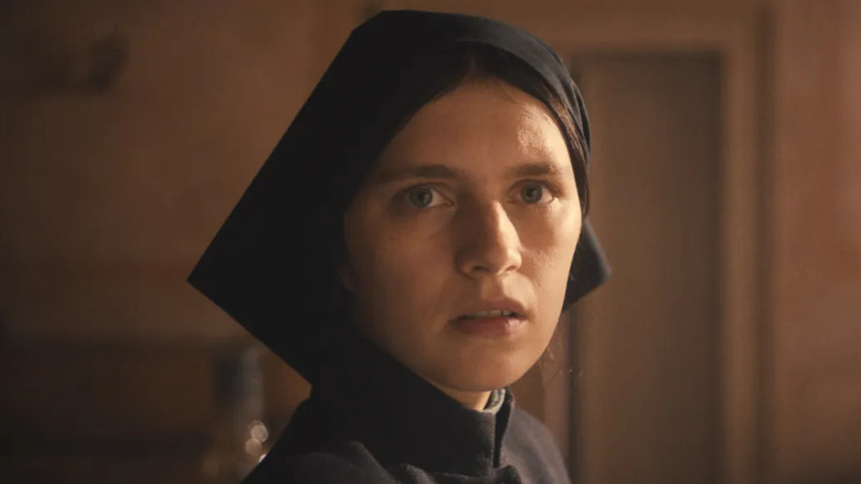 Nell Tiger Free as Margret, looking disturbed in The First Omen