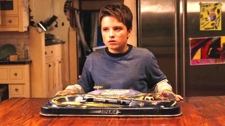 Walter (Josh Hutcherson) with the Zathura board game in Zathura: A Space Adventure