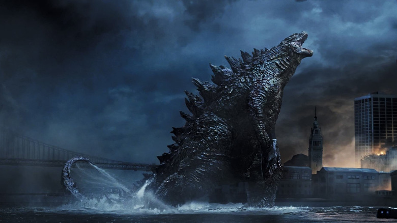 Godzilla roars while standing in water in Godzilla