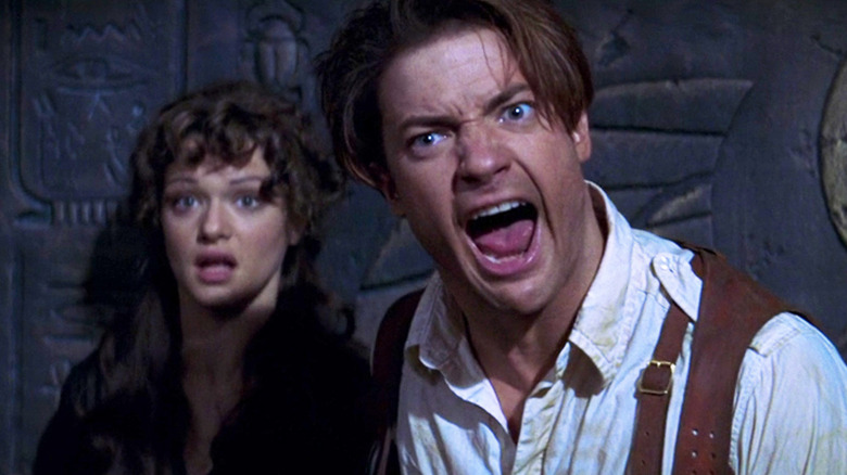 Brendan Fraser as Rick O'Connell yells next to Rachel Weisz as Evelyn in The Mummy