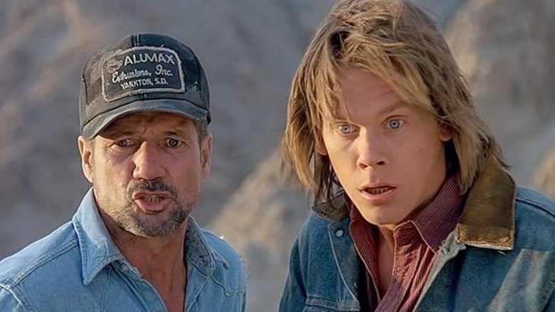 Fred Ward as Earl looks shocked next to Kevin Bacon as Val in Tremors