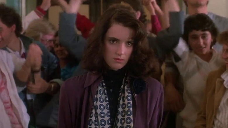 Winona Ryder as Veronica in a crowded hallway in Heathers