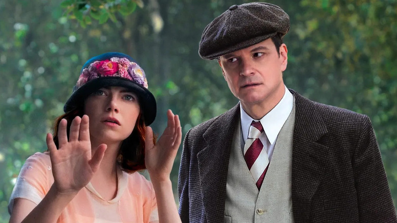 Emma Stone and Colin Firth as Sophie and Stanley, standing near trees as she prognosticates in Magic in the Moonlight