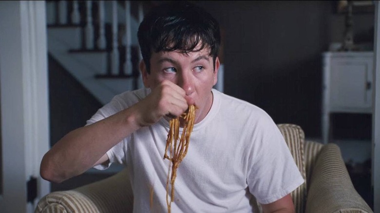 Martin Lang (Barry Keoghan) eats spaghetti with his hands in The Killing of a Sacred Deer