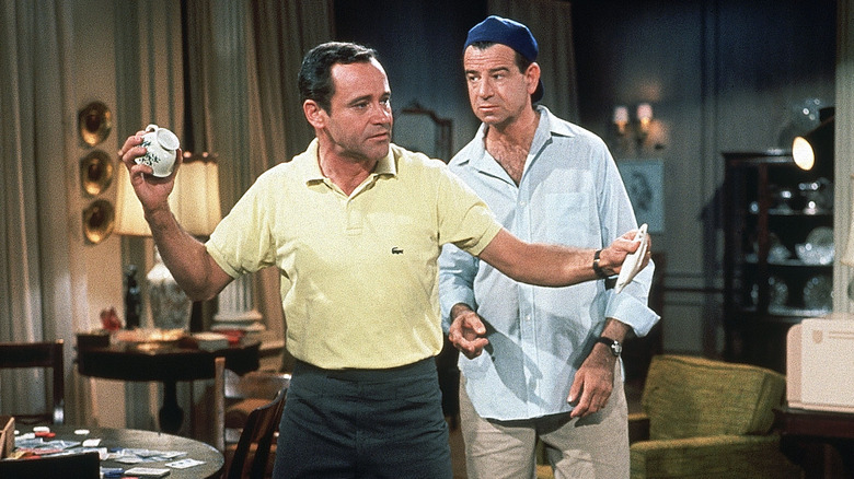 Felix (Jack Lemmon) and Oscar (Walter Matthau) reckon with fine china in The Odd Couple