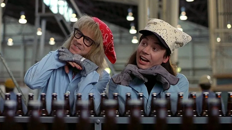 Wayne (Mike Myers) and Garth (Dana Carvey) recreate the bottling factory scene from Laverne & Shirley in Wayne's World