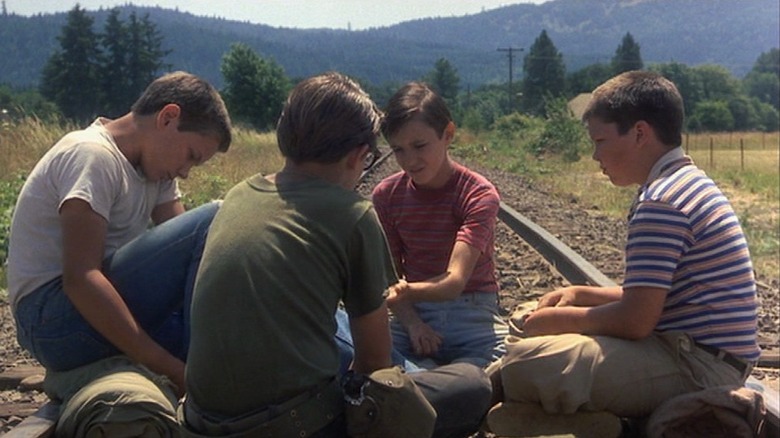 Boys sitting on train tracks in Stand By Me
