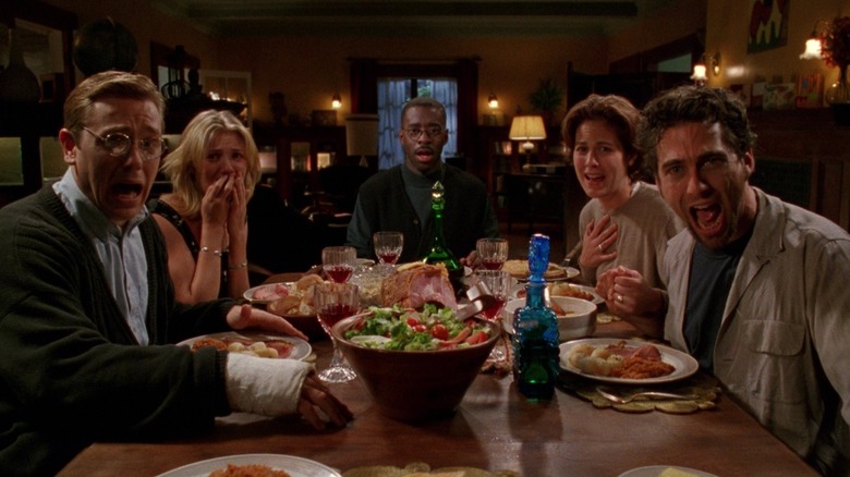Ron Eldard as Pete, Cameron Diaz as Jude, Courtney B. Vance as Luke, Annabeth Gish as Paulie, and Jonathan Penner as Marc sitting around dinner table looking toward camera with shocked faces in The Last Supper