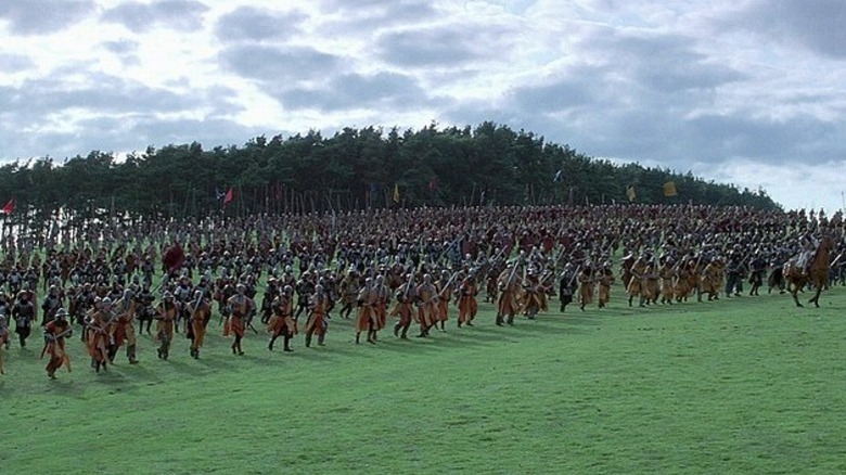 Army running in grass field in Braveheart
