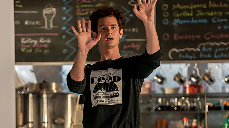 Andrew Garfield as Jonathan Larson, conducting in a diner in Tick Tick Boom