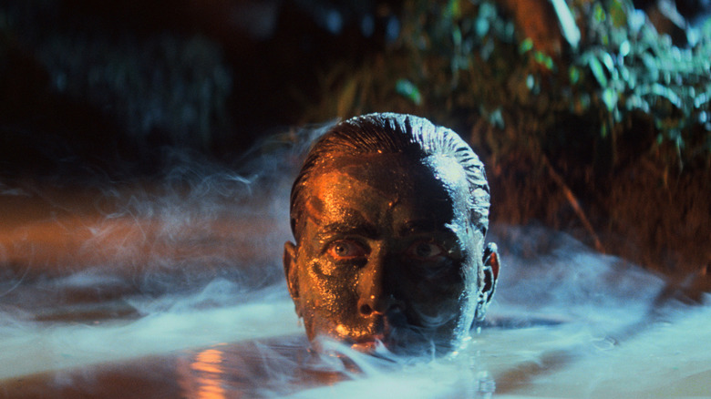 Martin Sheen as Captain Benjamin L. Willard sticks his head out of the water in Apocalypse Now