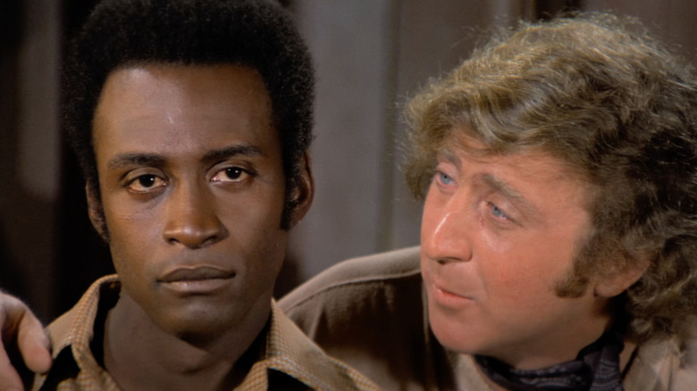 Cleavon Little as Bart listens to Gene Wilder as the Waco Kid in Blazing Saddles