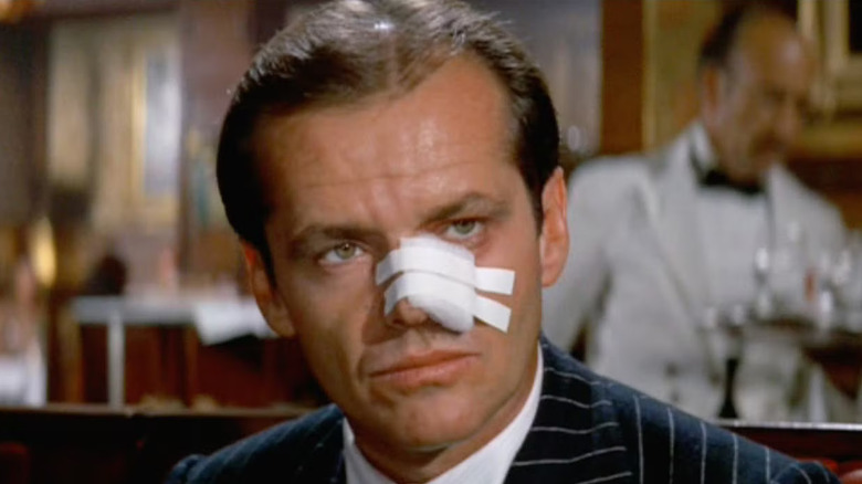 Jack Nicholson as Jake Gittes wears a nose bandage in Chinatown
