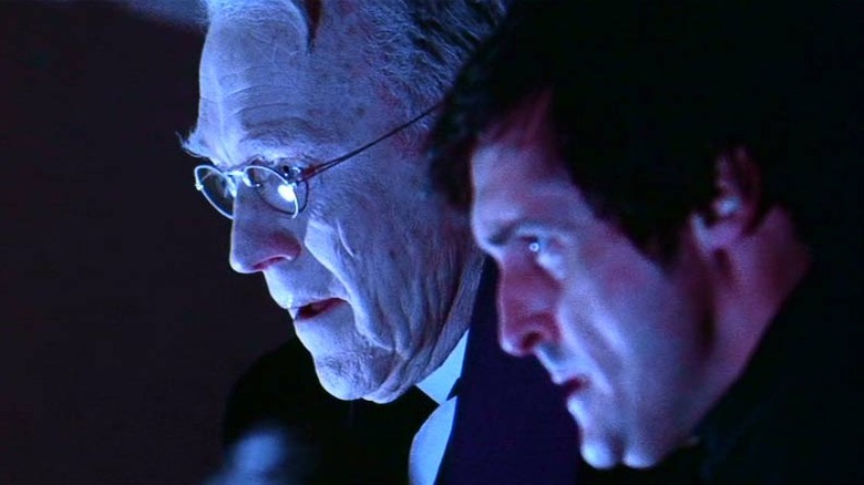 Max von Sydow as Lankester Merrin stands next to Jason Miller as Damien Karras in The Exorcist