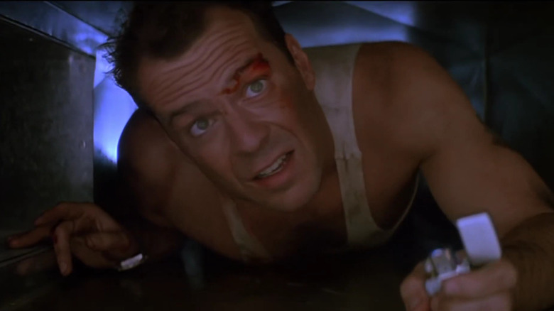 John McClane (Bruce Willis) in air vent in Die Hard