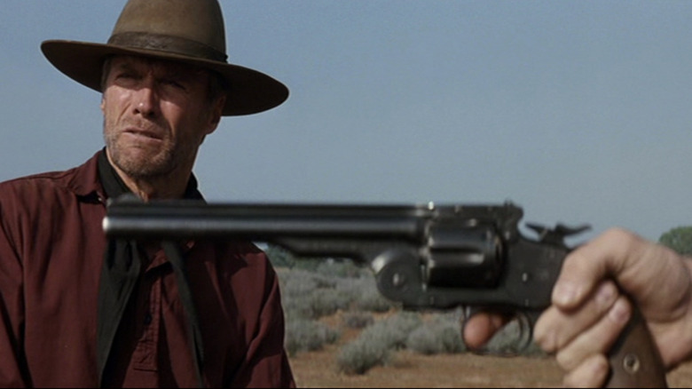 William Munny (Clint Eastwood) shows how to shoot a gun in Unforgiven