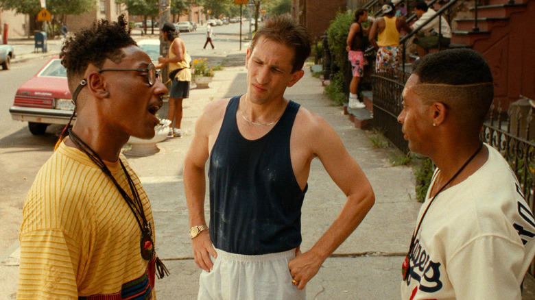 Giancarlo Esposito as Buggin' Out standing with Richard Edson as Vito and Spike Lee as Mookie on a Brooklyn street in Do the Right Thing