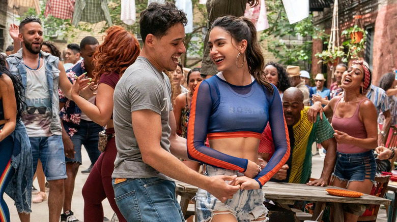 Anthony Ramos as Usnavi and Melissa Barrera as Vanessa, dancing together in In the Heights.