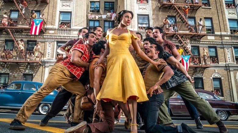 Ariana DeBose as Anita, surrounded by men in West Side Story.