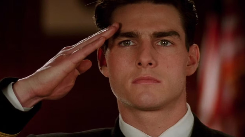 Tom Cruise as Daniel Kaffee saluting in a court room in A Few Good Men