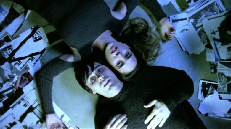Jared Leto and Jennifer Connelly as Harry and Marion laying on the floor together in Requiem for a Dream