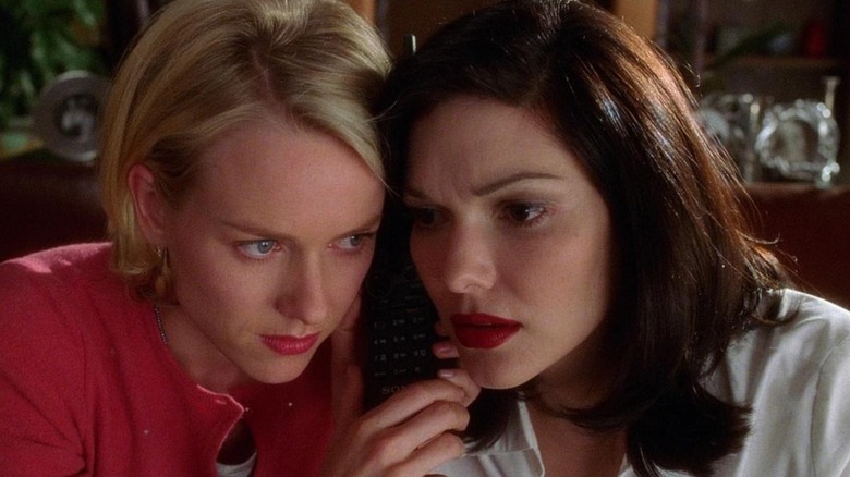 Naomi Watts as Betty Elms and Laura Harring as Rita in Mulholland Drive, with their heads together listening in on a phone call.