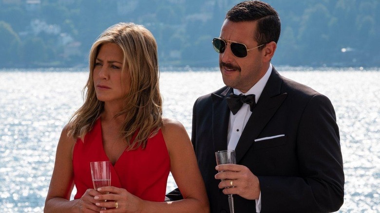 Jennifer Aniston as Audrey and Adam Sandler as Nick, enjoying a yacht trip in Murder Mystery