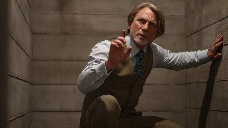 Daniel Craig as Benoit, investigating a murder in Wake Up Dead Man