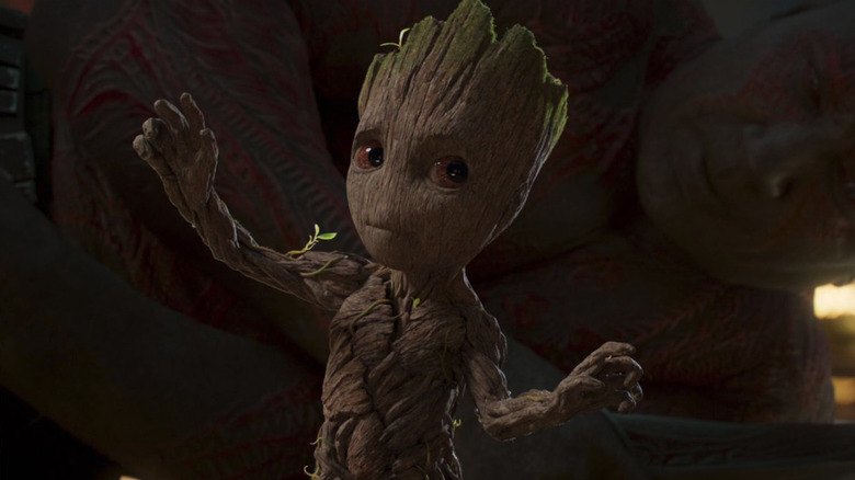 Baby Groot trying not to get caught dancing by Drax in Guardians of the Galaxy Vol. 2