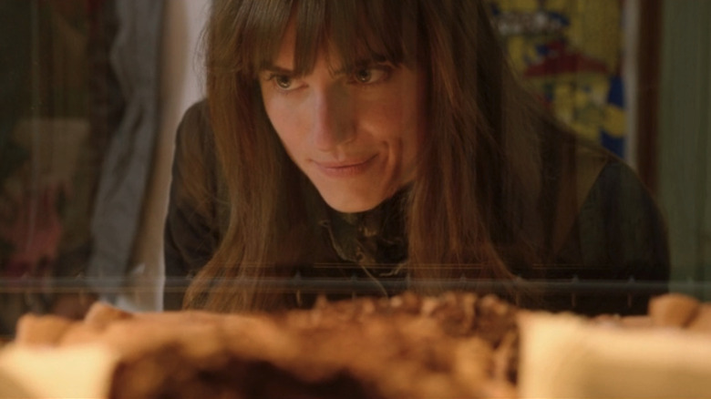 Allison Williams as Rose looks at fresh baked goods in Get Out